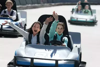 happy girls in go-kart