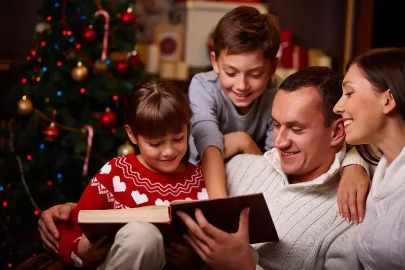 family reading a christmas story at a pigeon forge cabin