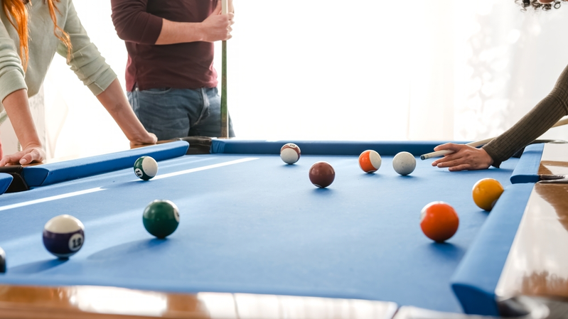 Friends playing pool