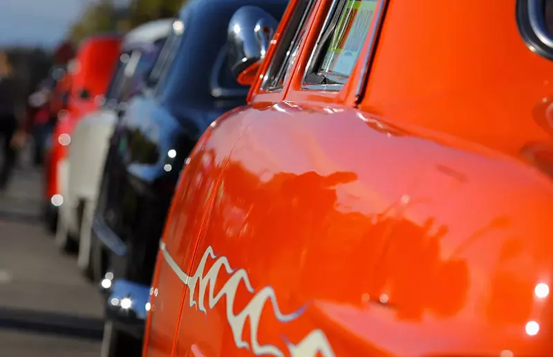 Line of old cars at car show